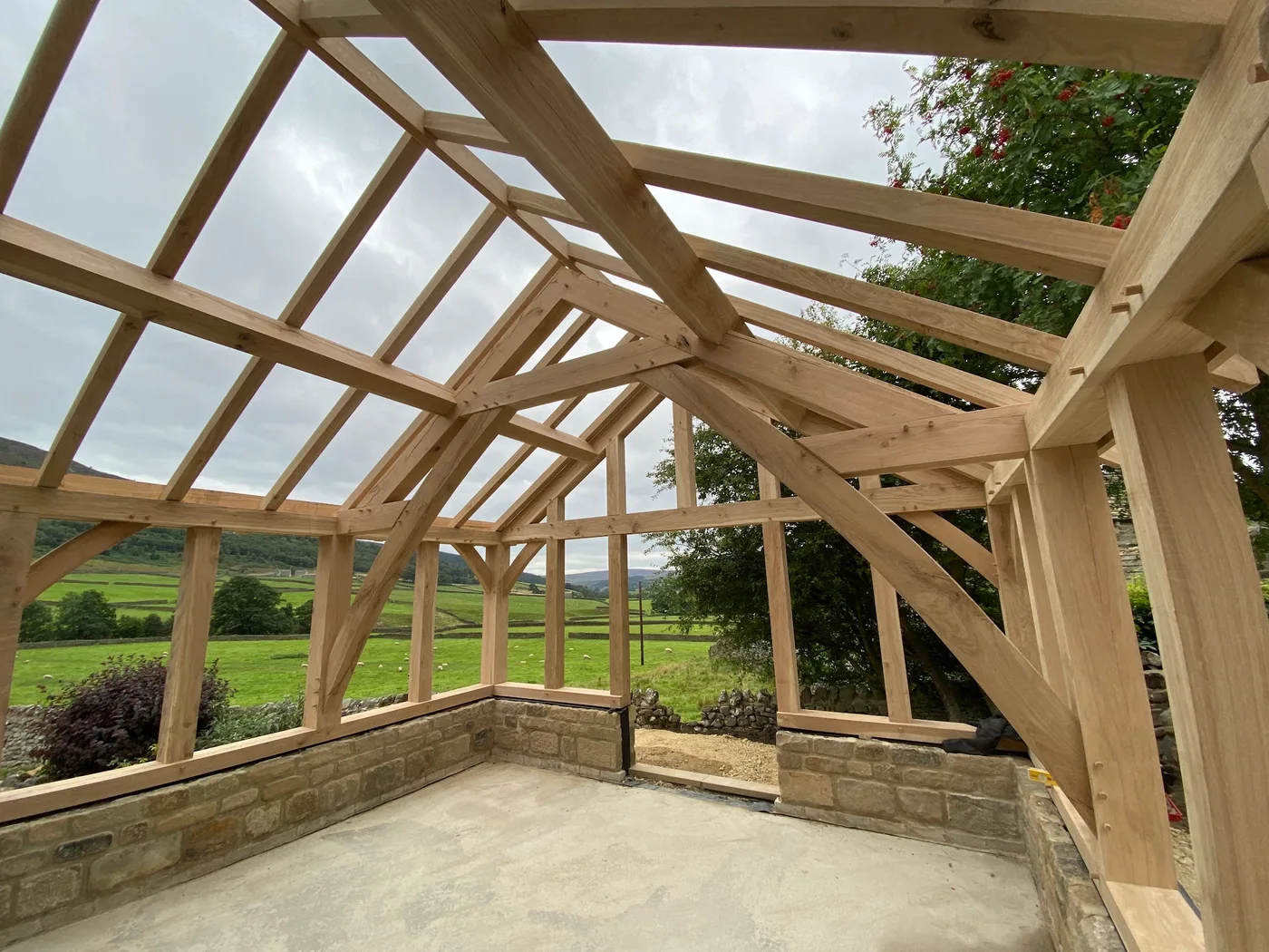Timber framing with the surrounding countryside visible beyond